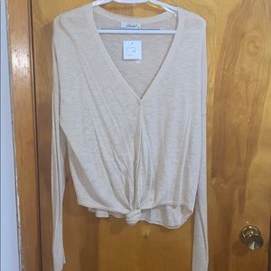 Oatmeal color button down V neck knit sweater.